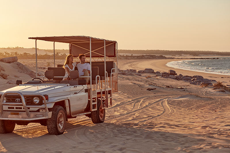 4WD on beach sunset